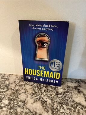 The Housemaid by Freida McFadden - Blue & Yellow Paperback